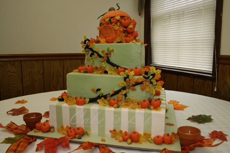 Autumnthemed Wedding Cake The cake is covered in buttercream with 